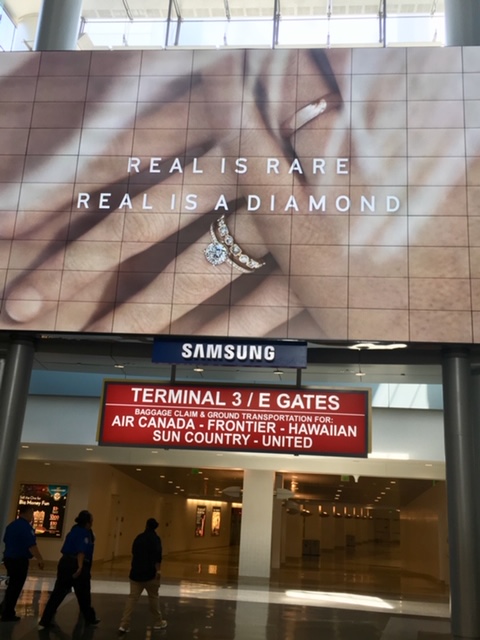 airport signage real is rare real is a diamond campaign